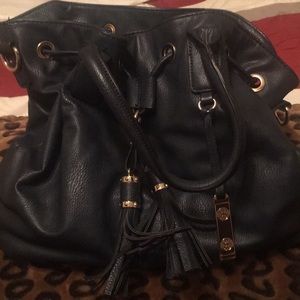 A dark blue arm bag